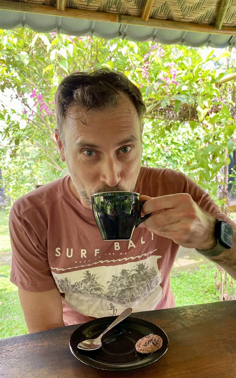 Rob enjoying a coffee in a garden